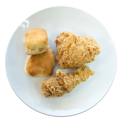 Fried chicken pieces with biscuits