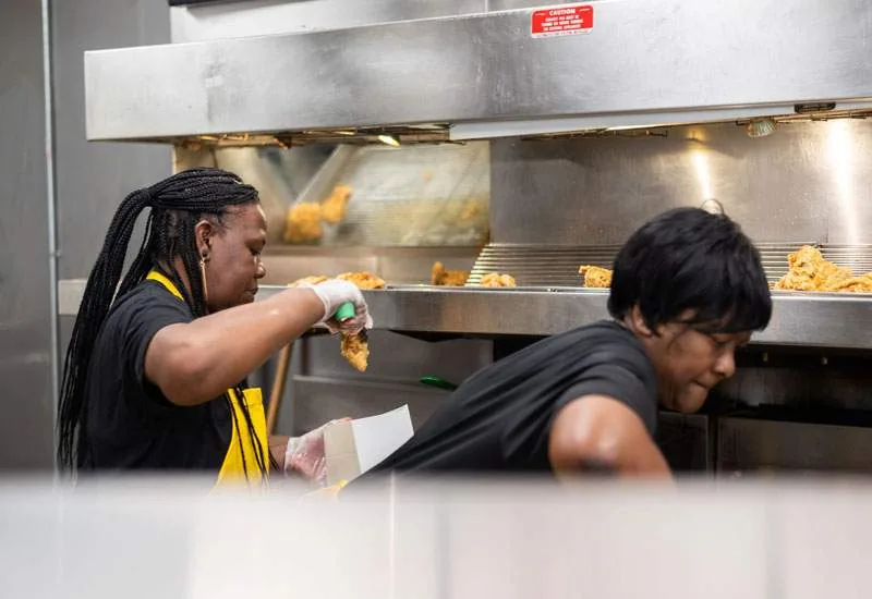 A Creole Fried Chicken hot counter stocked for service