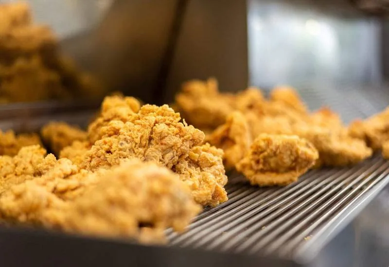 Golden Creole Fried Chicken fresh from the fryer